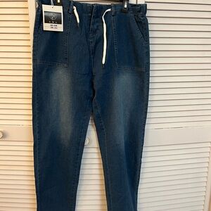 Brand new women’s blue jeans. Straight leg.
